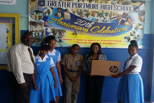 vybz kartel clothing line donates computer to portmore school